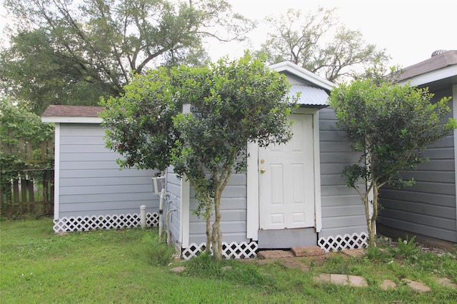 view of shed with fence