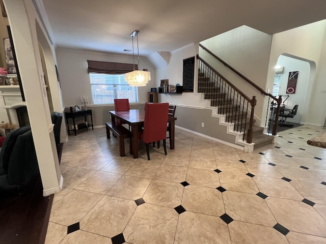 dining area featuring crown molding, light tile patterned floors, an inviting chandelier, and stairs