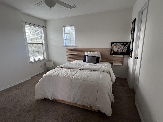 carpeted bedroom featuring baseboards and ceiling fan