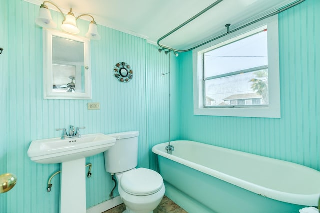 11213 Schwartz Dr, Galveston, TX 77554 - bathroom featuring a freestanding bath, walk in shower, and toilet