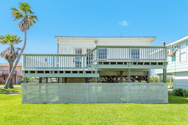 11213 Schwartz Dr, Galveston, TX 77554 - rear view of property with a deck and a lawn