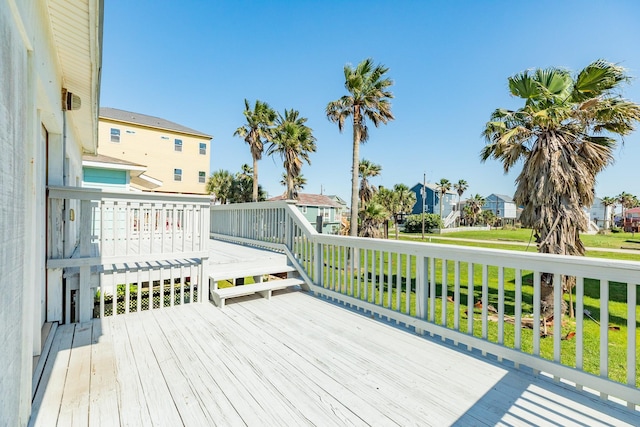 11213 Schwartz Dr, Galveston, TX 77554 - wooden terrace featuring a residential view and a lawn