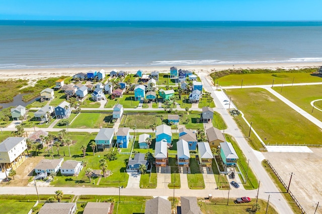 11213 Schwartz Dr, Galveston, TX 77554 - drone / aerial view featuring a water view, a residential view, and a view of the beach