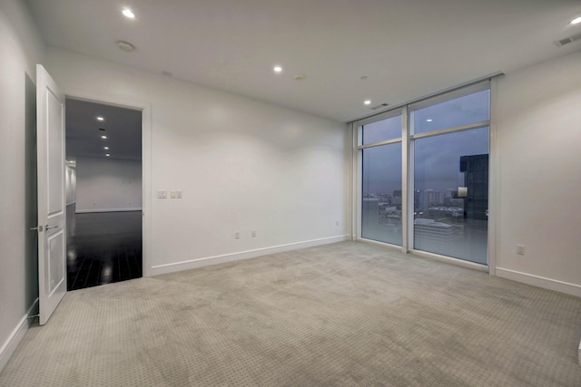 4521 San Felipe St Unit 2304-5, Houston, TX 77027 - spare room featuring recessed lighting, baseboards, and light colored carpet