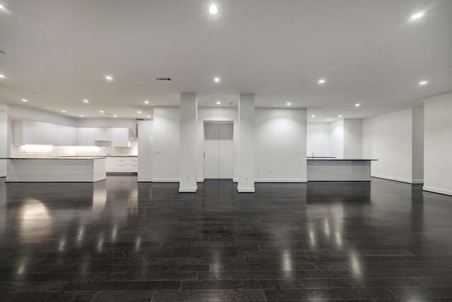 4521 San Felipe St Unit 2304-5, Houston, TX 77027 - living room featuring recessed lighting, dark wood finished floors, baseboards, and visible vents