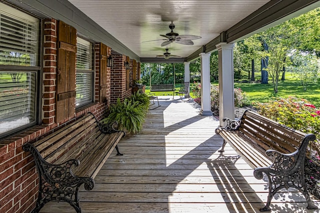 wooden deck with a ceiling fan and covered porch