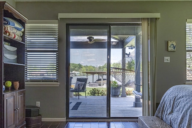 doorway with baseboards and a healthy amount of sunlight