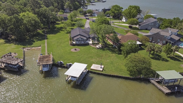 birds eye view of property featuring a water view and a residential view
