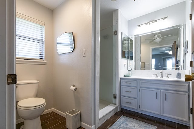 full bathroom with a shower stall, toilet, a ceiling fan, and wood tiled floor