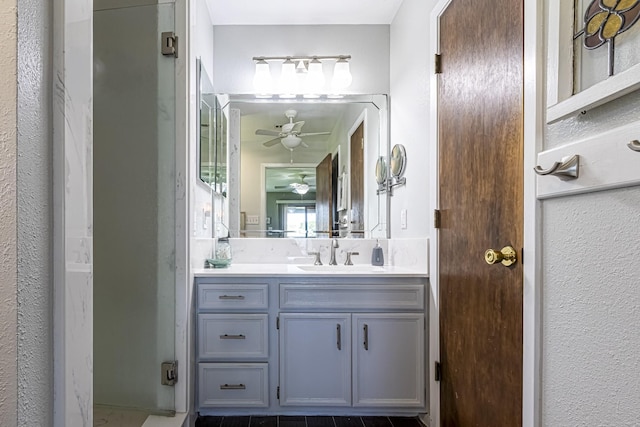 bathroom featuring a ceiling fan and vanity
