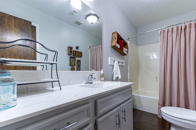 full bath with toilet, visible vents, shower / bathtub combination with curtain, vanity, and wood finish floors