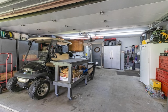 garage with water heater and a garage door opener