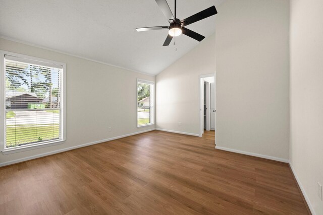 17311 Lowick St, Spring, TX 77379 - spare room featuring baseboards, ceiling fan, high vaulted ceiling, and wood finished floors