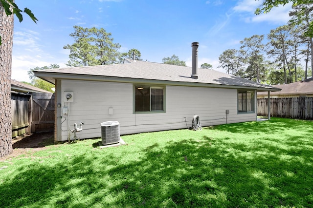 17311 Lowick St, Spring, TX 77379 - rear view of property with cooling unit and a shingled roof