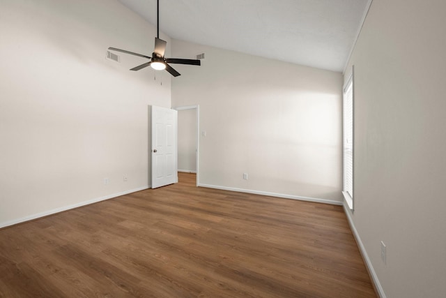 17311 Lowick St, Spring, TX 77379 - empty room with a ceiling fan, baseboards, wood finished floors, and high vaulted ceiling