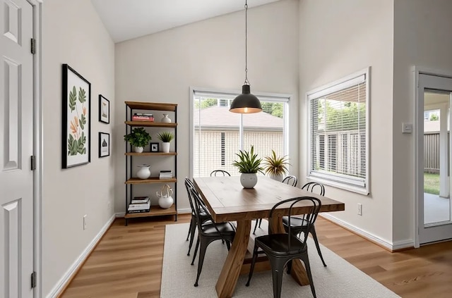 17311 Lowick St, Spring, TX 77379 - dining space featuring light wood-style floors, healthy amount of natural light, high vaulted ceiling, and baseboards