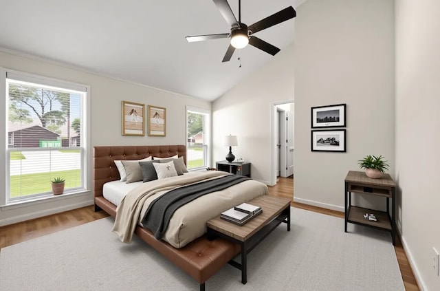 17311 Lowick St, Spring, TX 77379 - bedroom featuring wood finished floors, multiple windows, baseboards, high vaulted ceiling, and ceiling fan