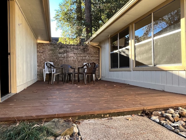 deck with outdoor dining area
