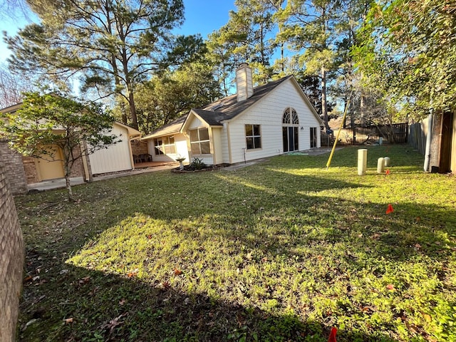 view of yard with an outbuilding and a fenced backyard
