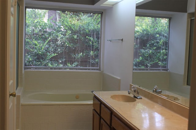 full bathroom featuring vanity and a garden tub