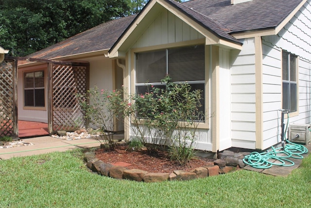 exterior space with a shingled roof