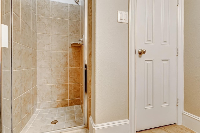 bathroom with a shower stall