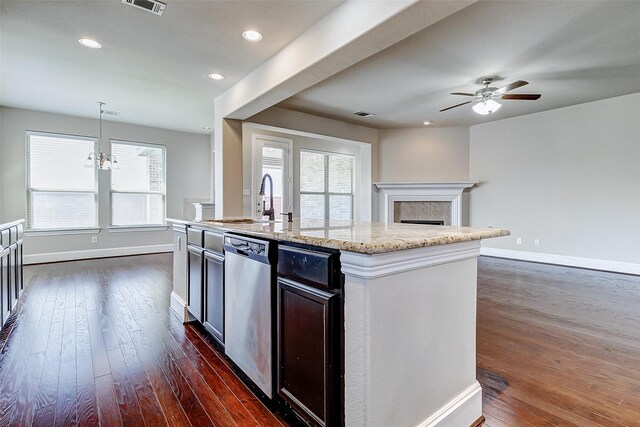 kitchen with a sink, stainless steel dishwasher, a ceiling fan, and dark wood-style flooring