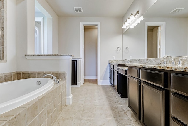 full bathroom with a garden tub, double vanity, tile patterned flooring, and visible vents