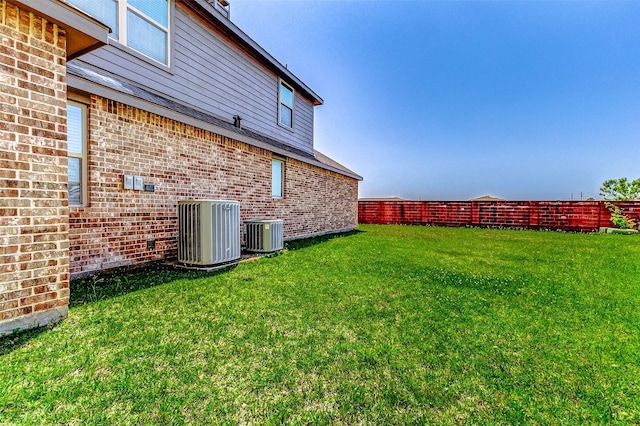 view of yard with central air condition unit