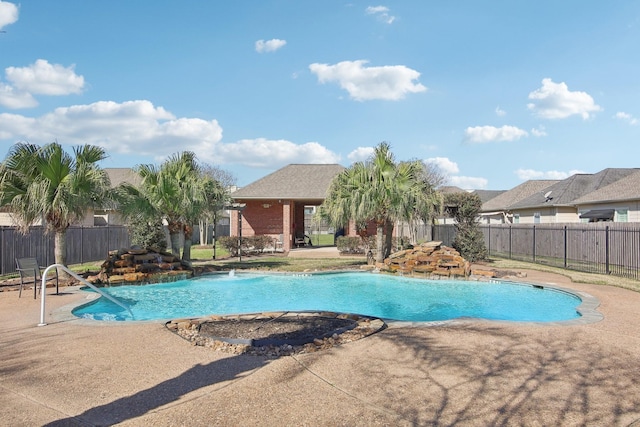 view of swimming pool featuring a fenced in pool, a patio area, and fence