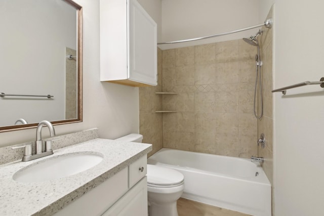 full bath featuring shower / bathtub combination, vanity, and toilet