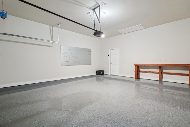 garage featuring baseboards and a garage door opener