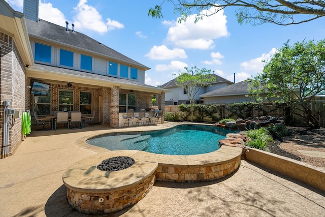 view of pool with a patio area, a fenced in pool, and fence