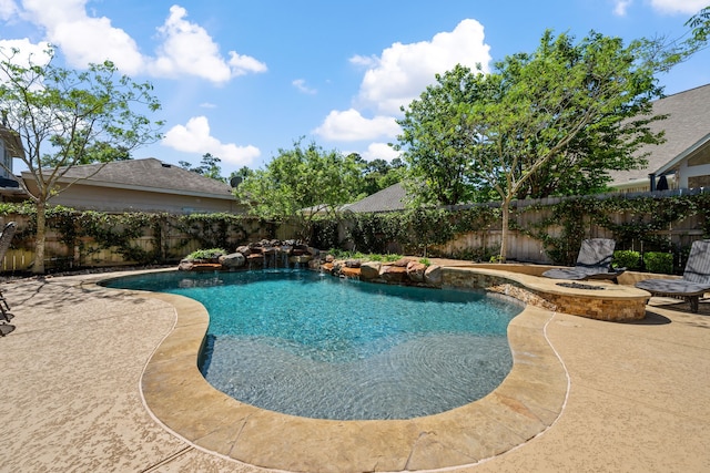 view of pool featuring a patio, a fenced backyard, a fenced in pool, and a fire pit