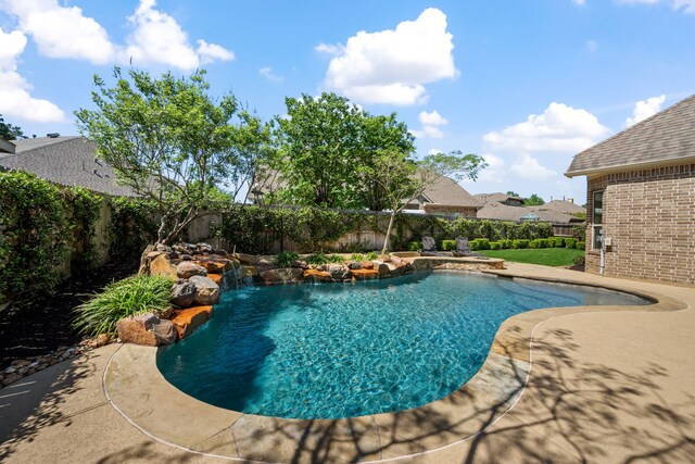 view of pool with a patio, a fenced backyard, and a fenced in pool