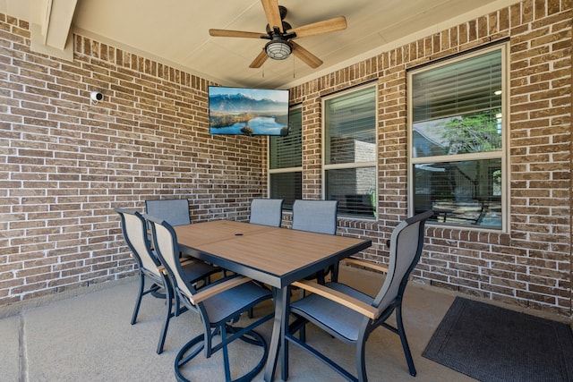 view of patio / terrace featuring outdoor dining space and a ceiling fan