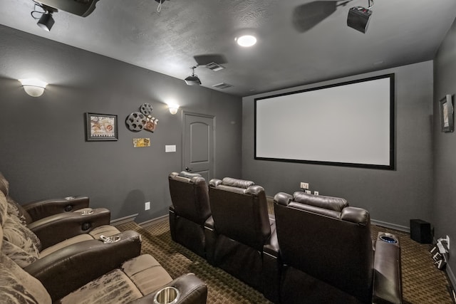 cinema room featuring visible vents, baseboards, and carpet flooring