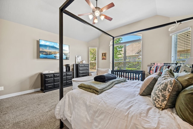 bedroom with carpet flooring, baseboards, a ceiling fan, and vaulted ceiling