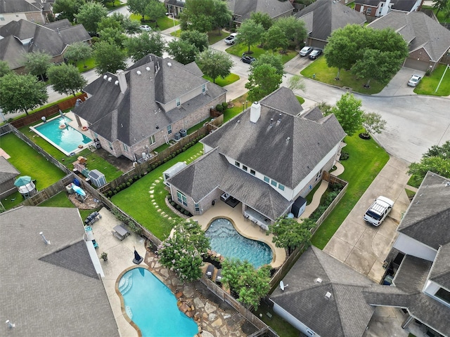 birds eye view of property with a residential view