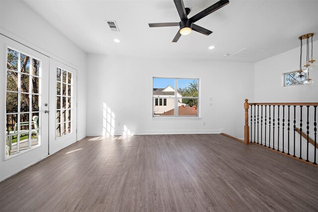 spare room featuring baseboards, recessed lighting, a ceiling fan, visible vents, and wood finished floors