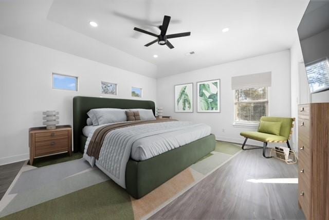 bedroom featuring baseboards, recessed lighting, wood finished floors, and a ceiling fan