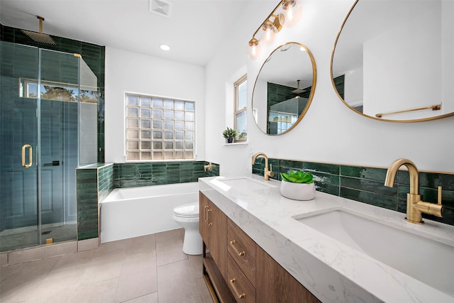 bathroom featuring a sink, visible vents, a shower stall, and tile patterned flooring