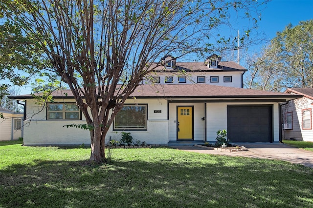 view of front of home featuring an attached garage, concrete driveway, and a front lawn