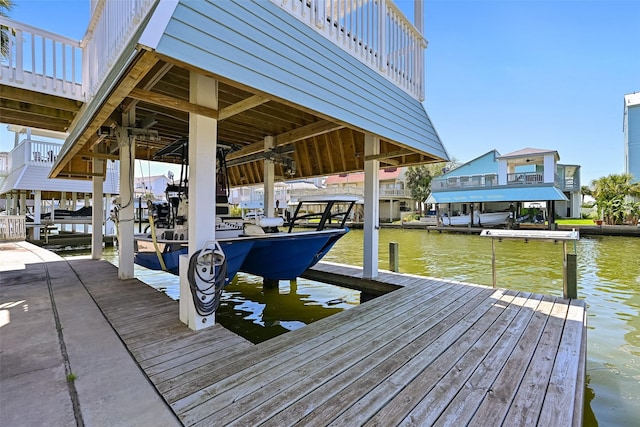 view of dock featuring a water view and boat lift