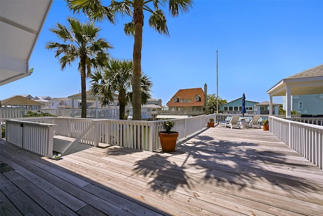 wooden deck featuring a residential view