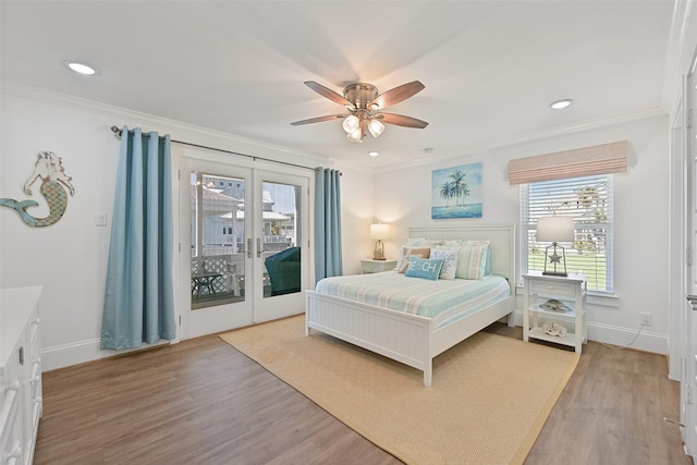 bedroom featuring ornamental molding, access to exterior, and light wood-type flooring