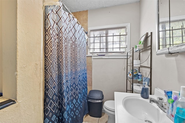 6109 Wayland St, Houston, TX 77021 - full bathroom featuring plenty of natural light, a shower with curtain, tile patterned flooring, a textured wall, and vanity