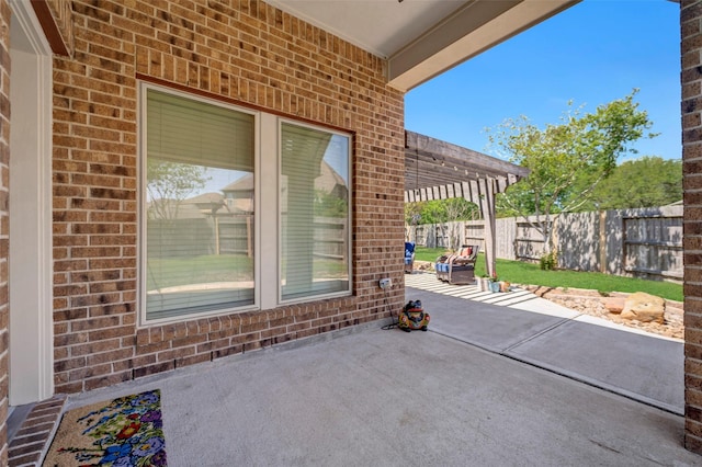 view of patio / terrace featuring a pergola and a fenced backyard