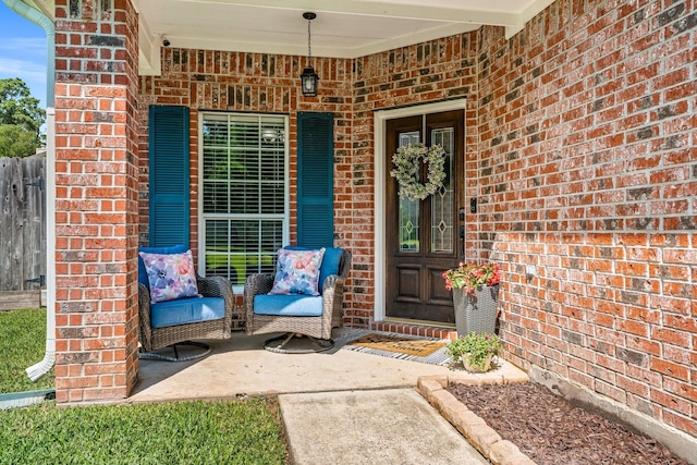 11926 Brightwood Dr, Montgomery, TX 77356 - doorway to property featuring brick siding and covered porch