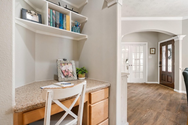 11926 Brightwood Dr, Montgomery, TX 77356 - interior space with arched walkways, ornamental molding, a textured ceiling, french doors, and light wood-style flooring